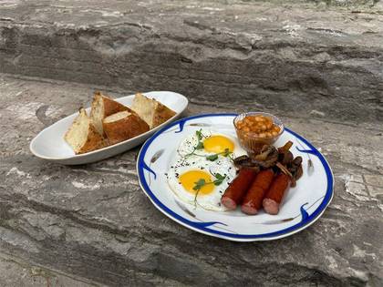 Breakfast with hunting sausages and mushrooms