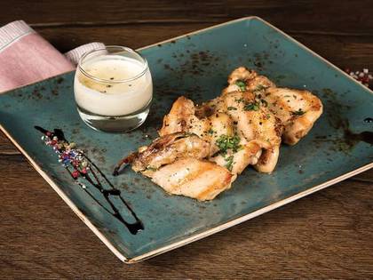 Juicy chicken thighs with pepper sauce