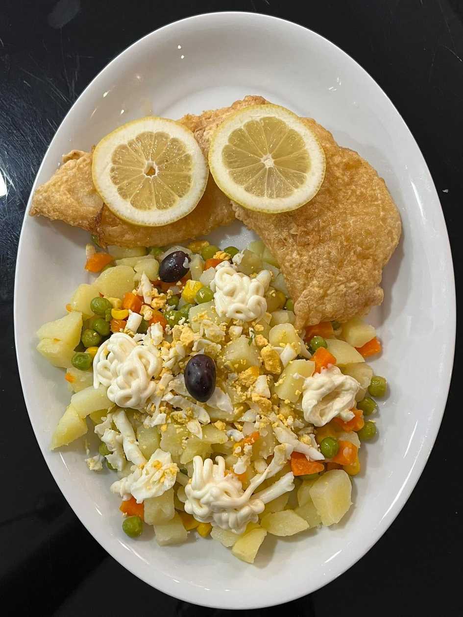 Hake fillets with Russian salad