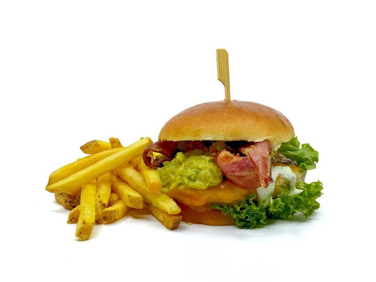 Chicken burger with cheese, bacon, guacamole & French fries