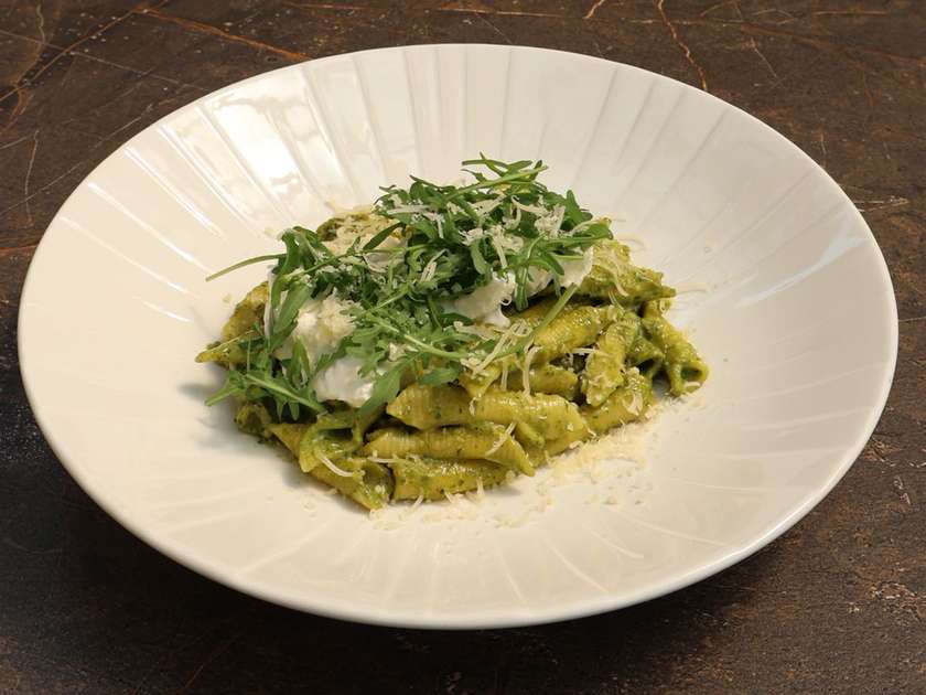 Tagliatelle pasta with homemade pesto sauce and burrata cheese