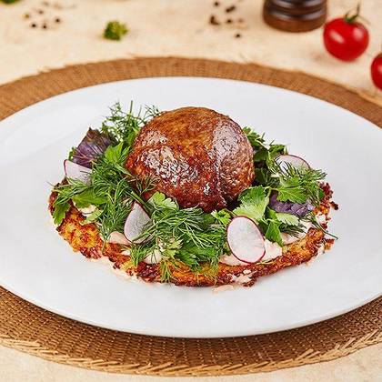Stuffed meat dome on potato pancake