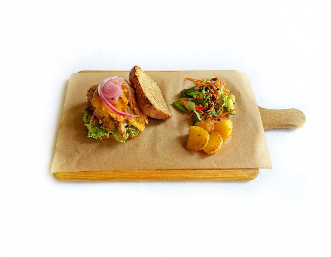 Sandwich with pulled pork shoulder, BBQ sauce, lettuce and pickles