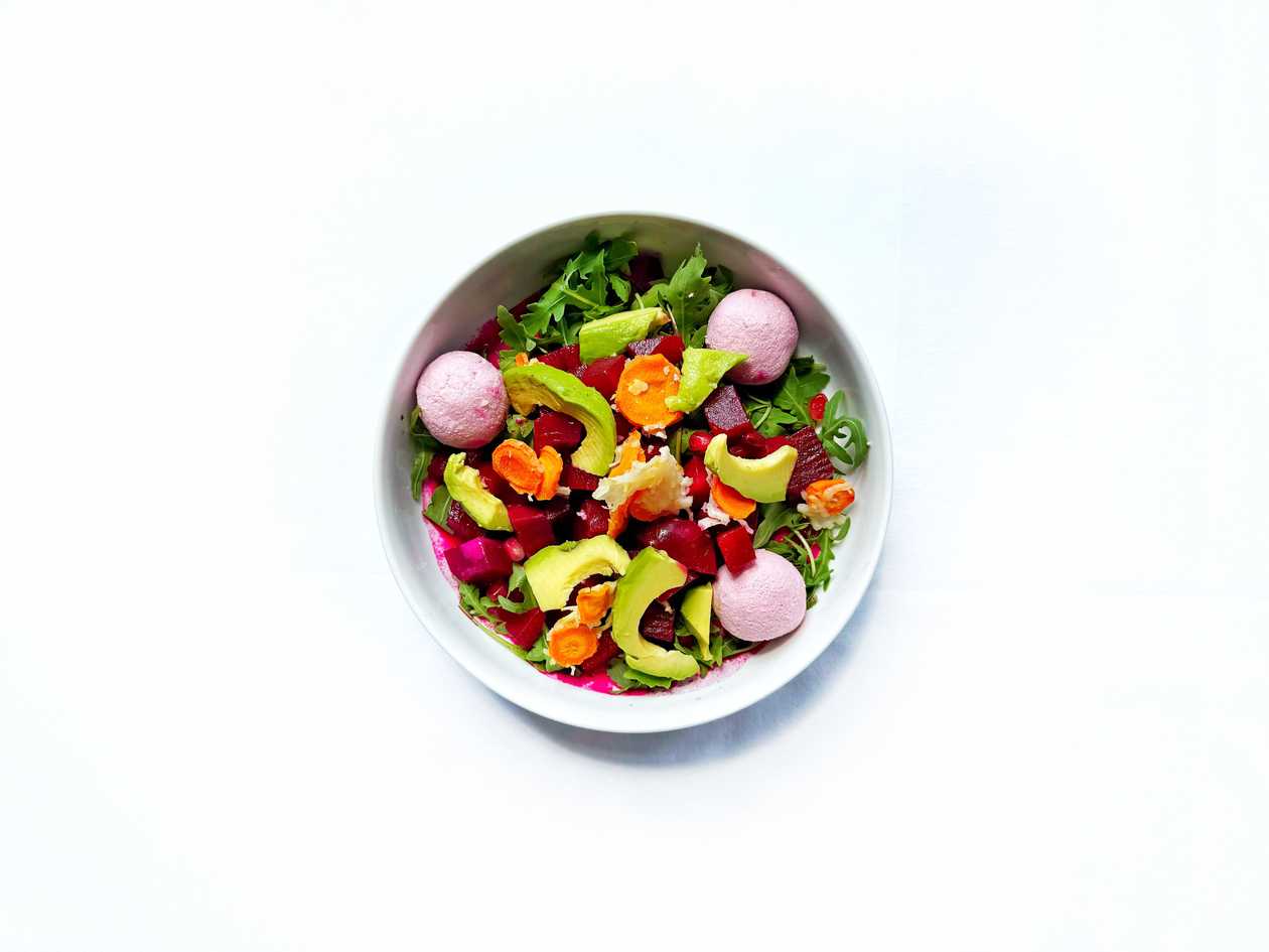 Beetroot, carrot salad with parmesan chips and avocado with yogurt dressing