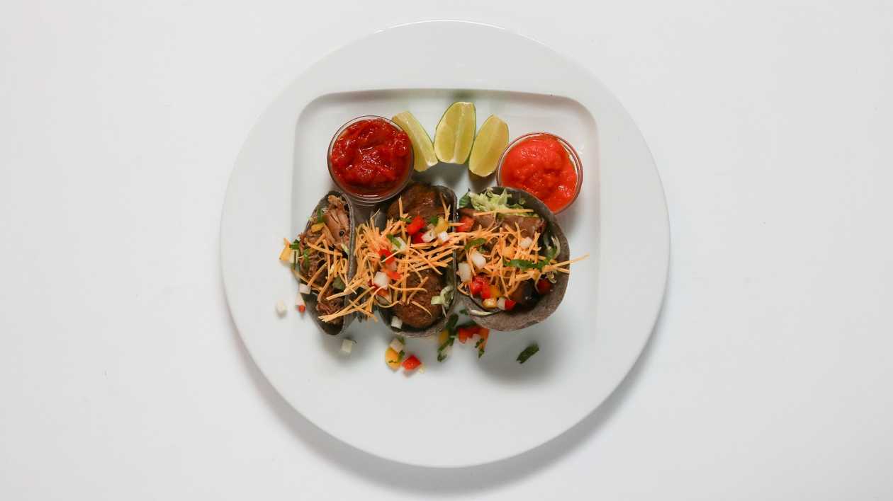 Tacos with smoked brisket, vegetables, cheddar, tomato and habanero salsa 4pcs