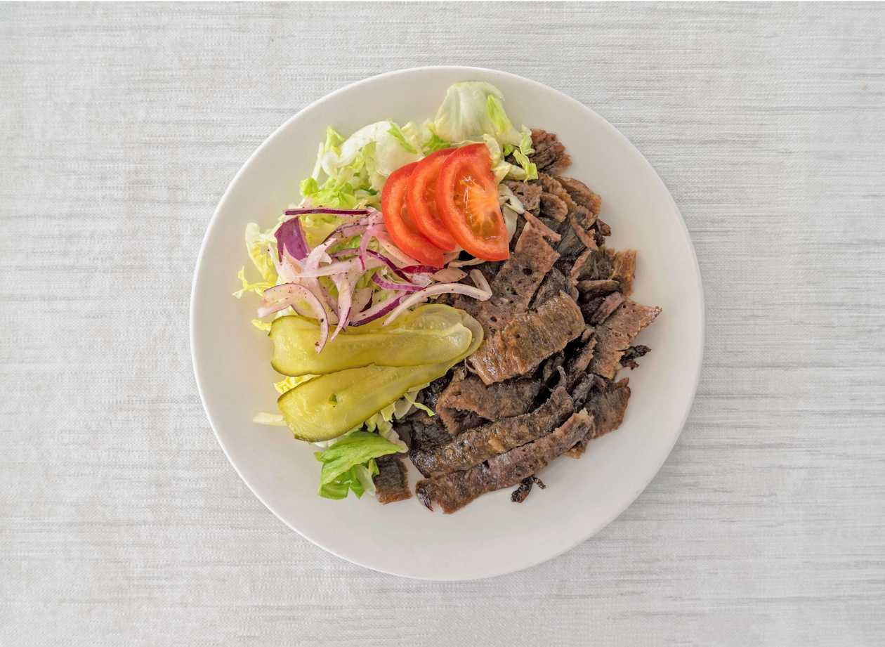 Veal kebap on a plate with a side dish double