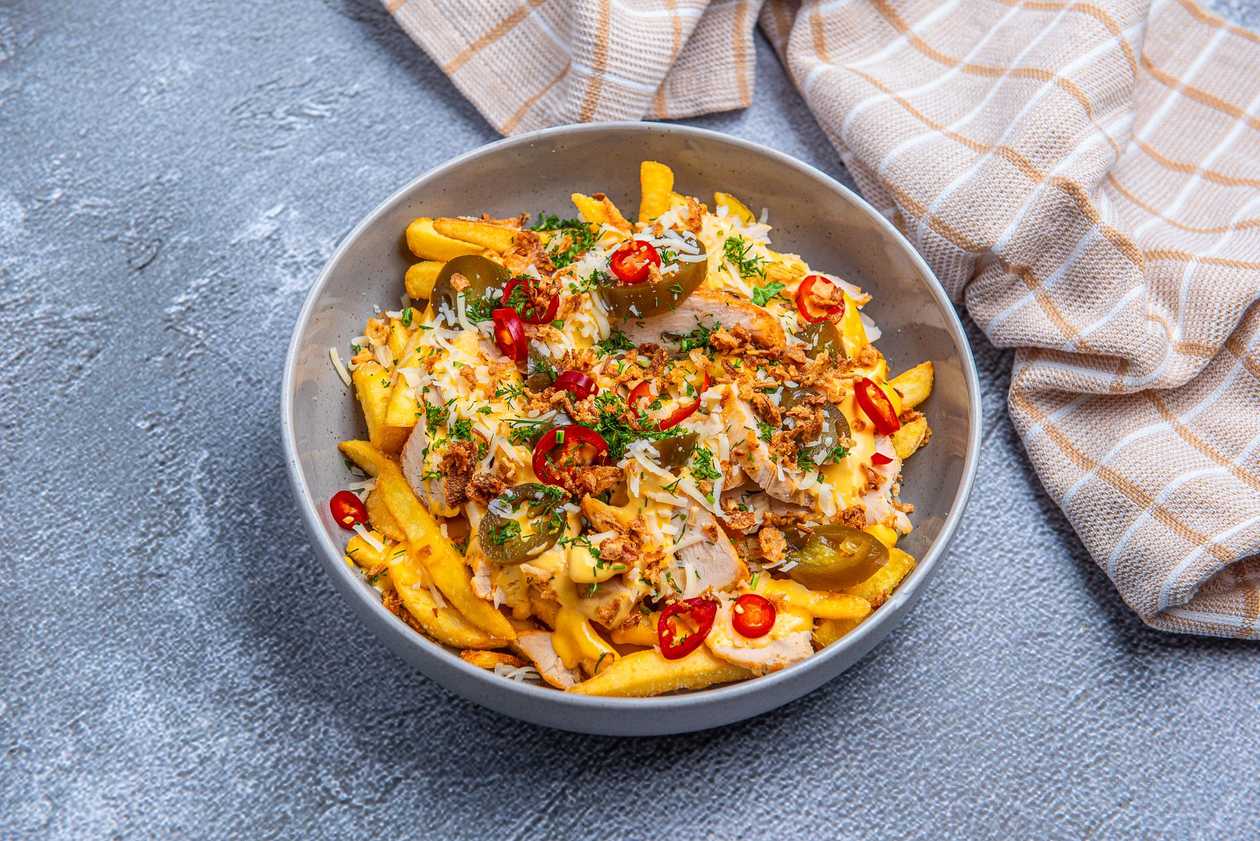 Loaded fries with chicken, cheddar, and jalapeños