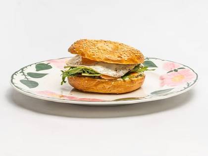 Bagel with Salmon, Fried Egg and Arugula
