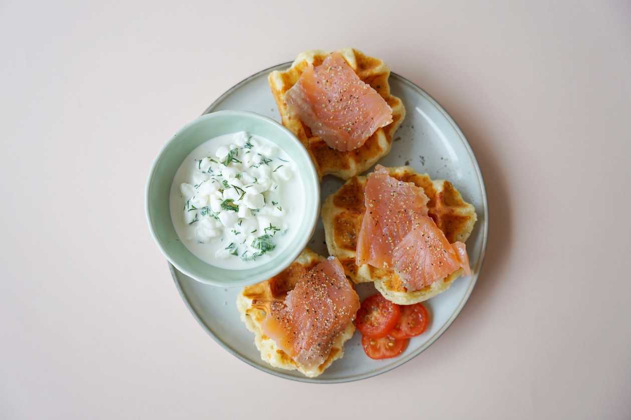 Cheese waffle bites with lightly salted salmon and green sauce
