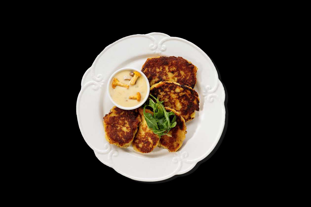 Fresh potato pancakes with chanterelle sauce