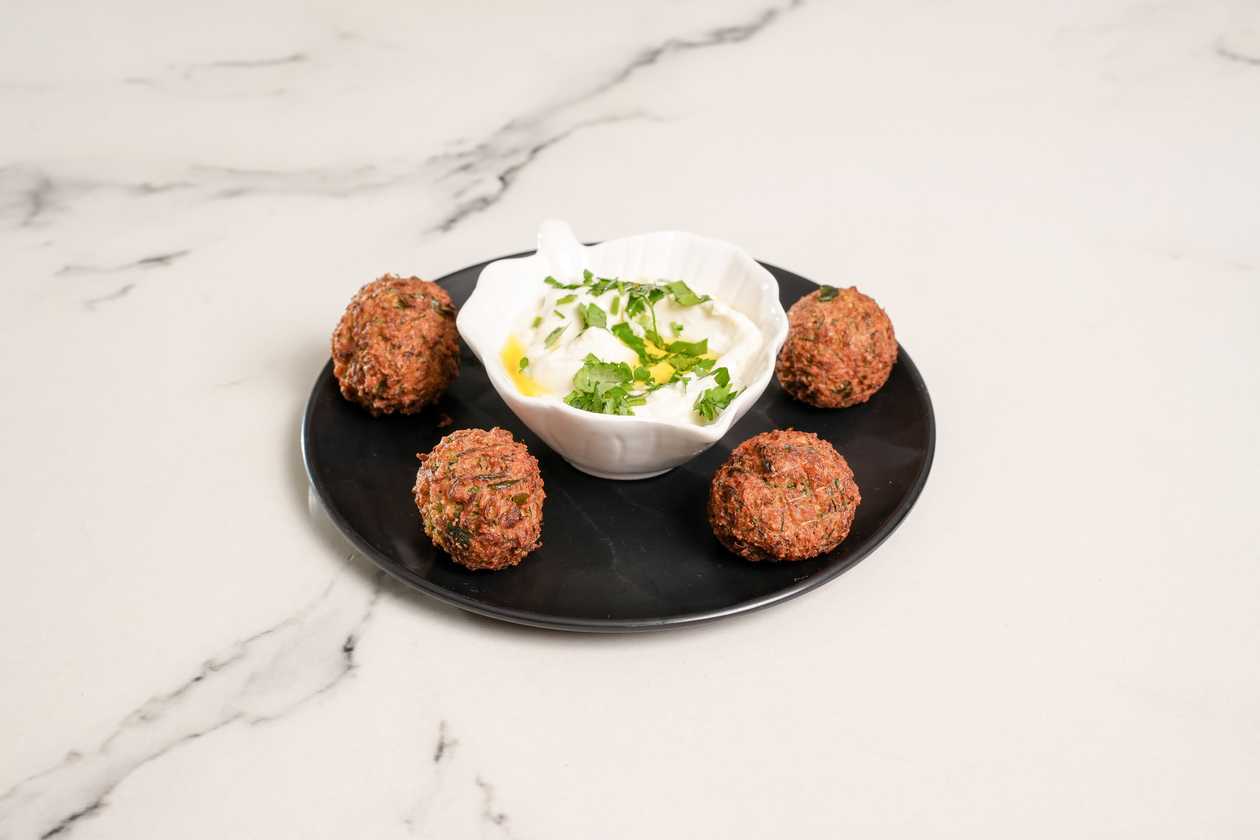 Kolokithokeftedes with Cheesy Sauce 🌱