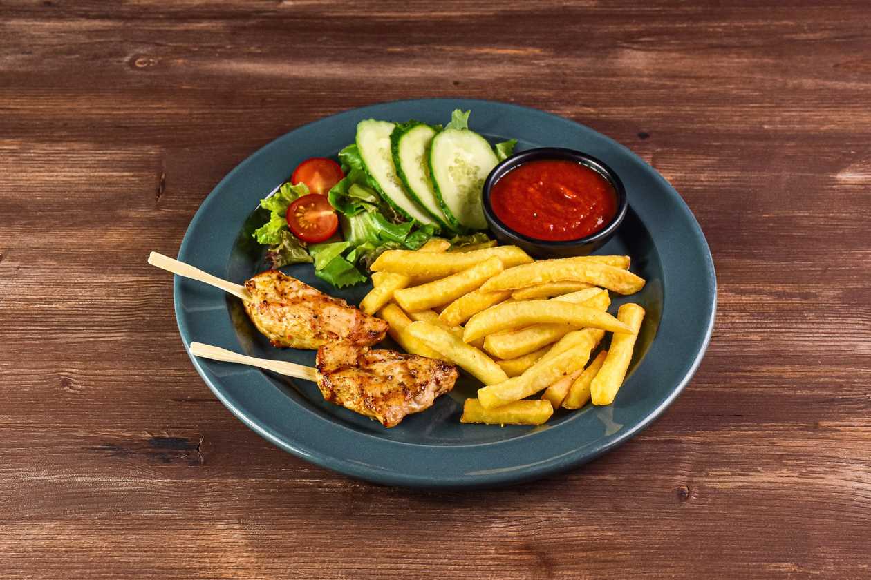 Chicken nuggets with fresh vegetables, tomato sauce and hot garnish optional: mashed potatoes, french fries or wedges