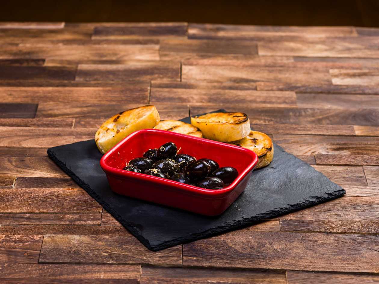 Our own selection of pickled olives, served with Ciabattu fried on charcoal