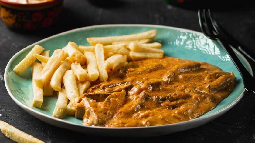 Beef stroganoff with mushrooms, beef and garnish