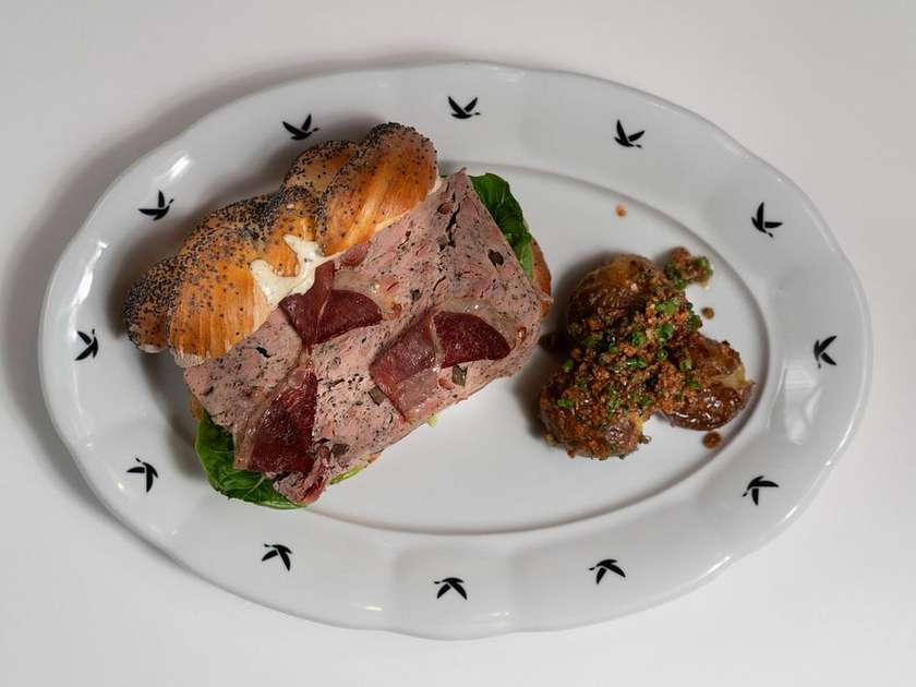 Duck meatloaf with truffles, poppy seed bun, pickled vegetables, smoked potatoes