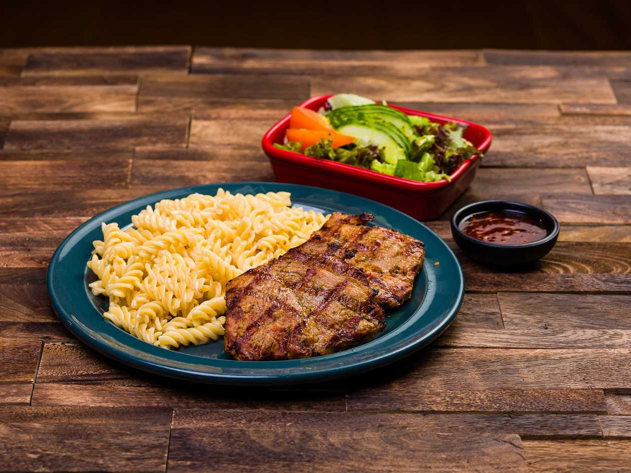 Pork steak medium. Large serving in the photo