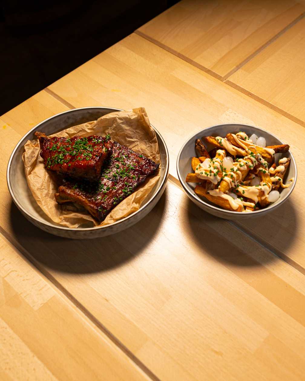 Marinated pork ribs, homemade french fries, sriracha mayo