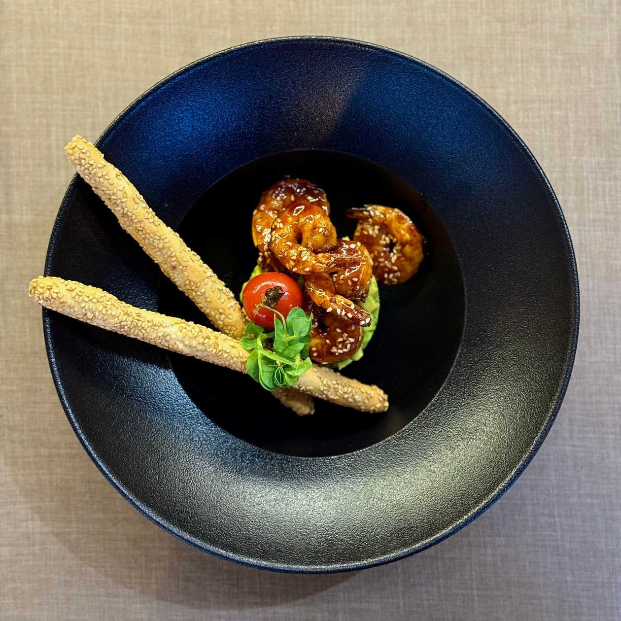 Avocado tartar, tiger prawns with Teriyaki glaze and sesame seeds