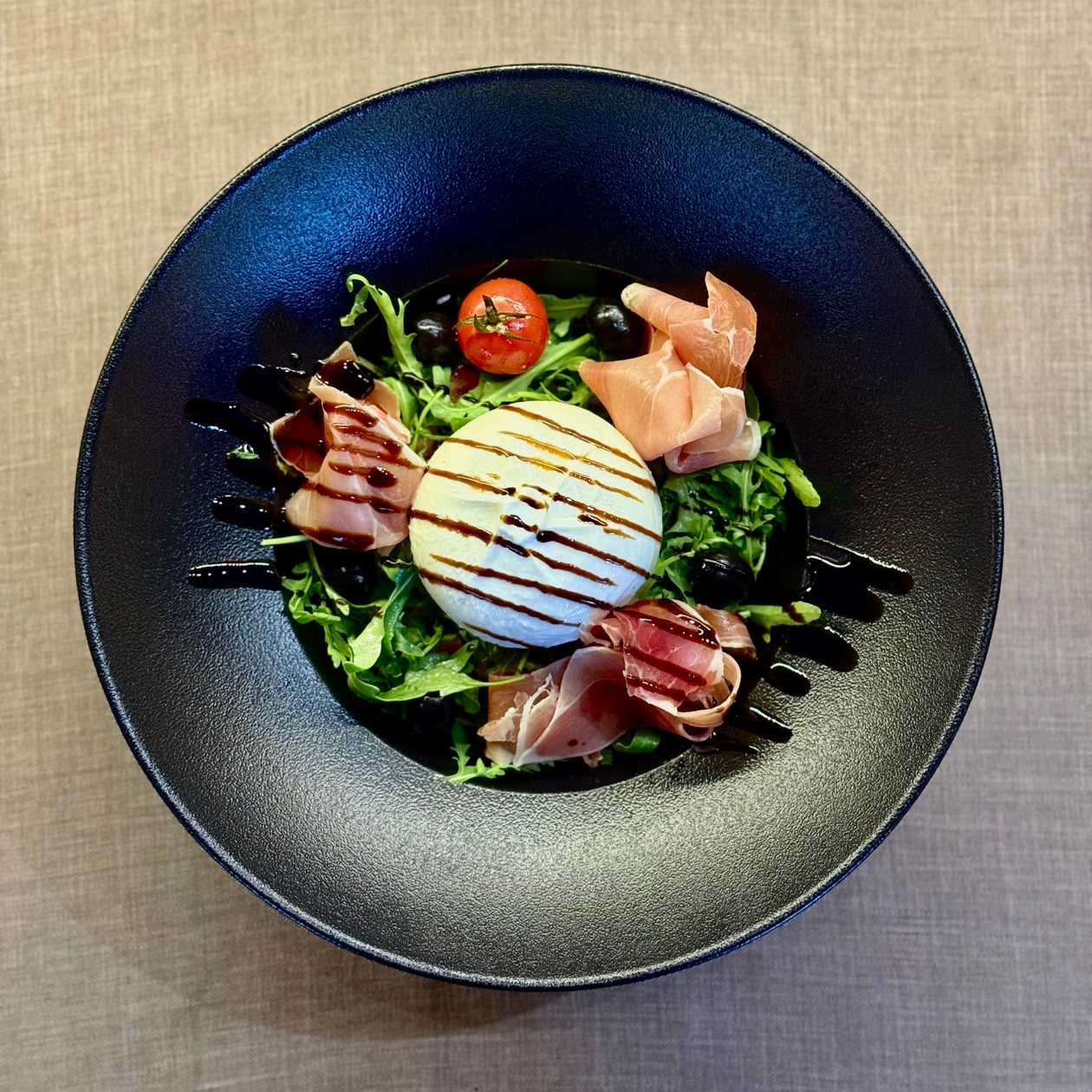 Buffalo Burrata with arugula, tomato salsa, olives & dried ham