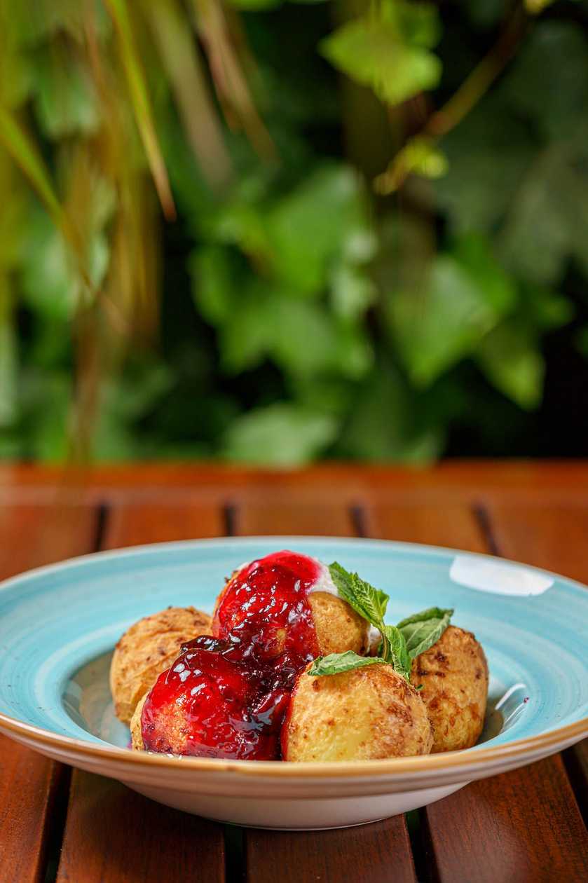 Traditional cheese dumplings with jam and sour cream