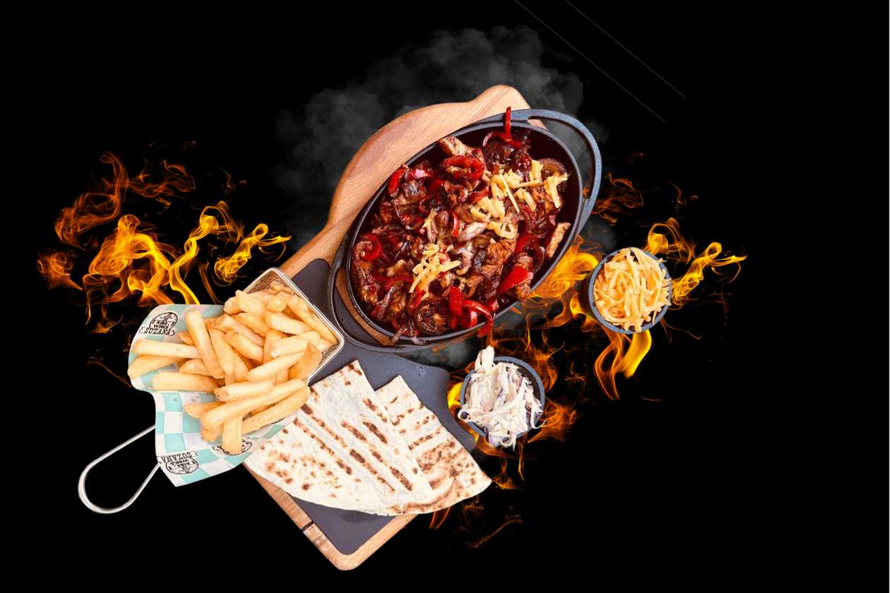 Beef Fajitas  - hot pan (Beef leg in a pan with sautéed vegetables and soy sauce)