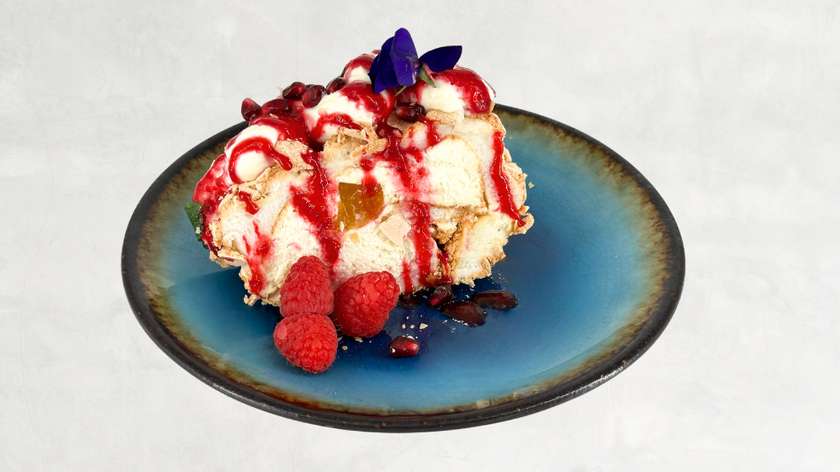 Meringue roulade with mascarpone cheese and seasonal fruit