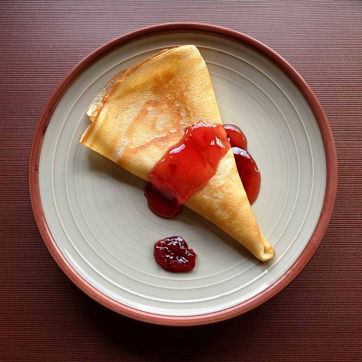 Pancakes with jam and whipped cream