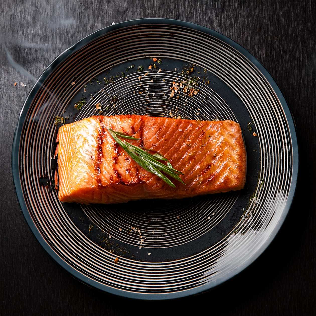 Salmon steak on a garnish