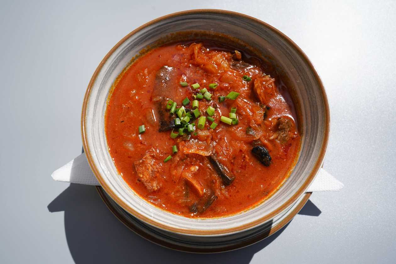 Farmer's sauerkraut soup with piece of bread