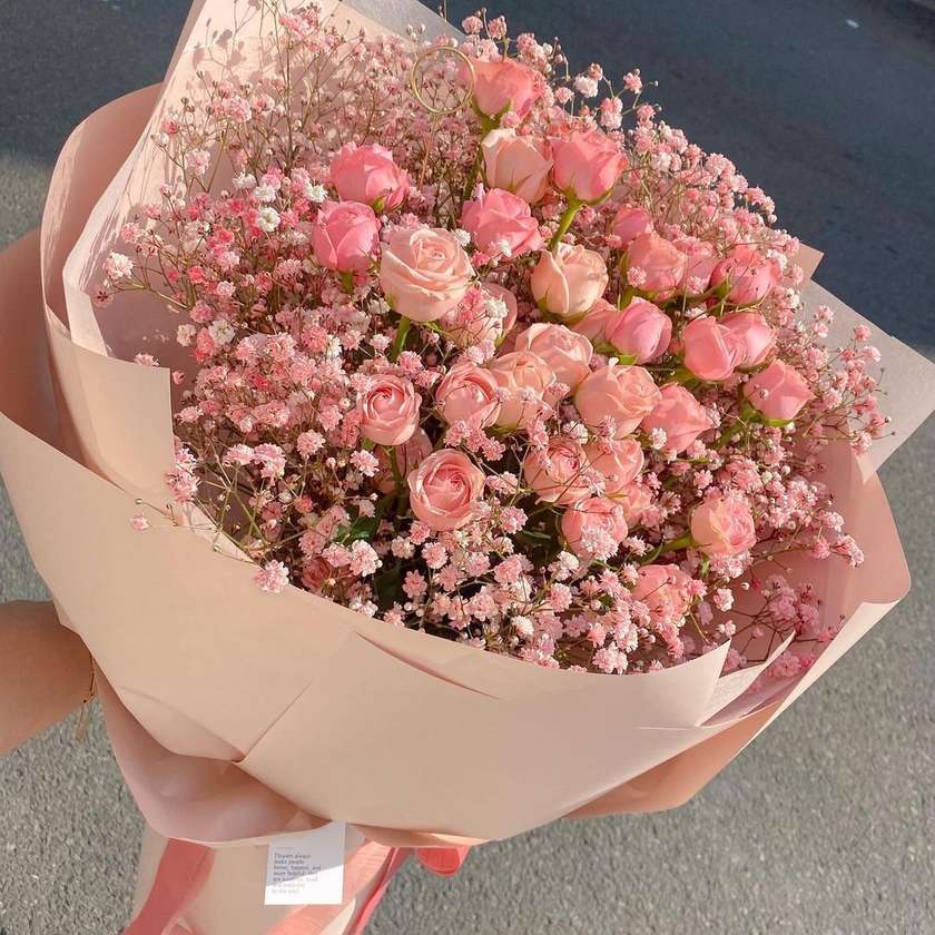 Bouquet of pink spray roses and gypsophila