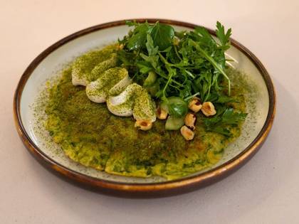 Zucchini Fritter with Daikon, Labneh Cheese, Nuts and Herbs