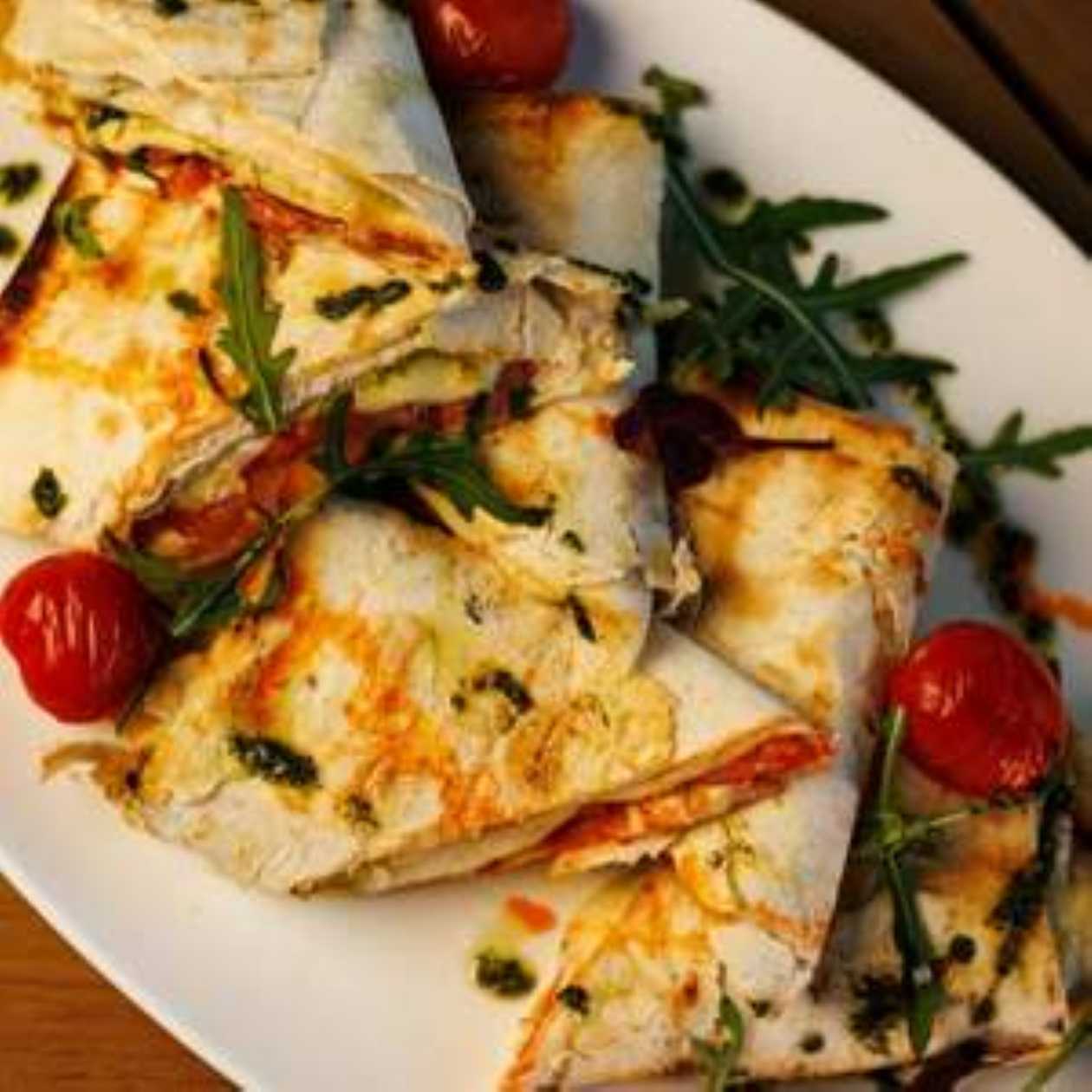 Lavash with Suluguni Cheese, Tomatoes and Pesto Sauce