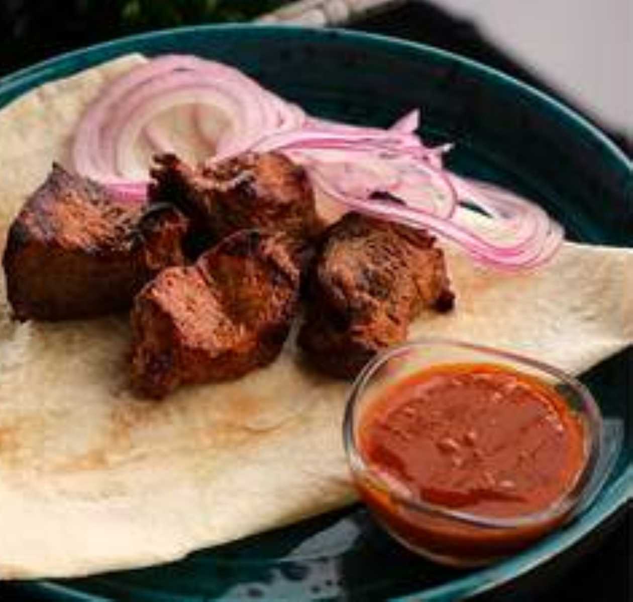Pork collar with roasted pepper sauce