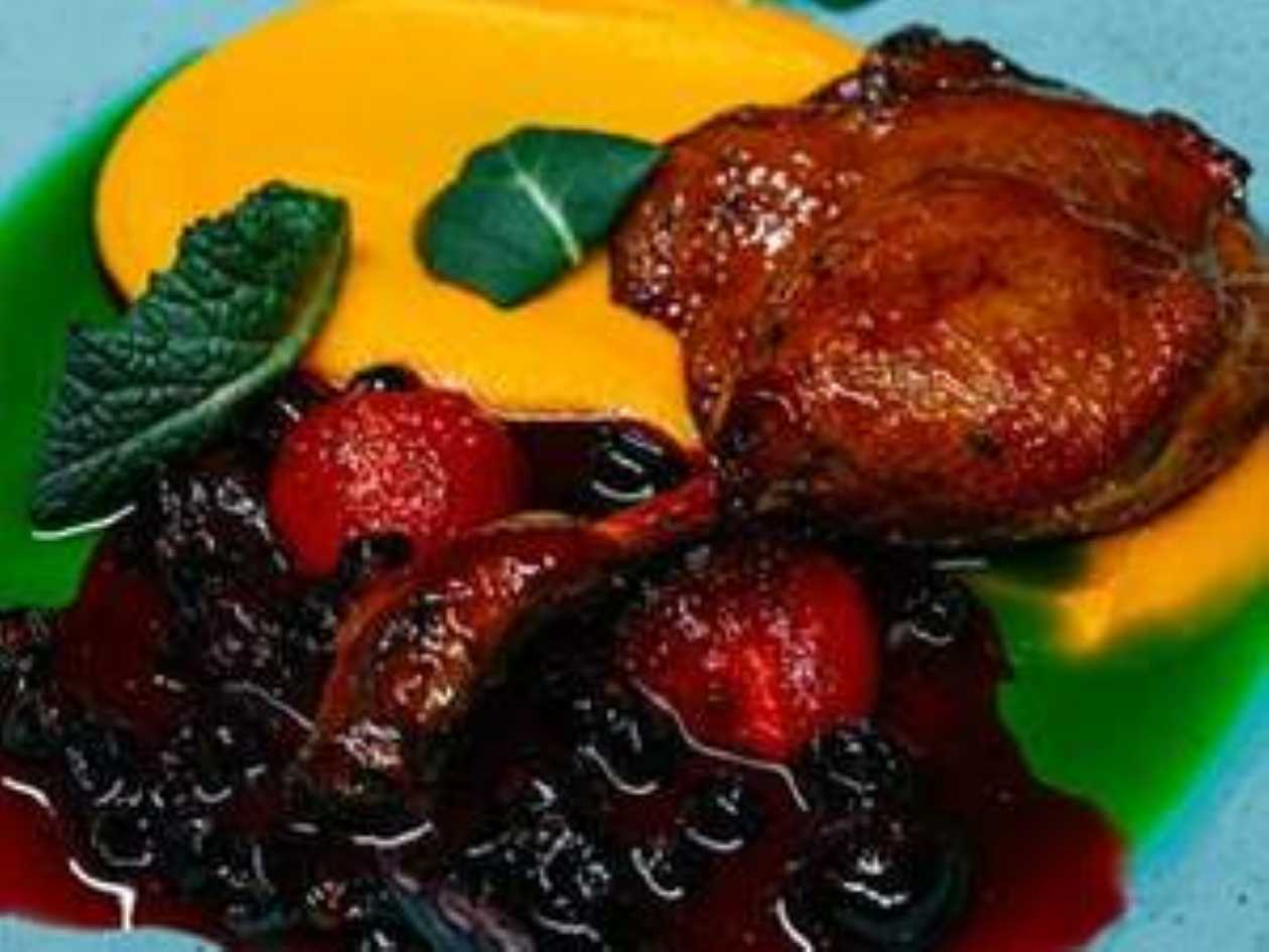 Duck leg with berries and sweet potato mousse