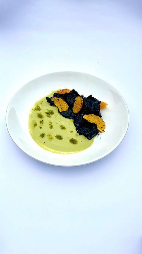 Dumplings with pike, burnt orange and pesto sauce.