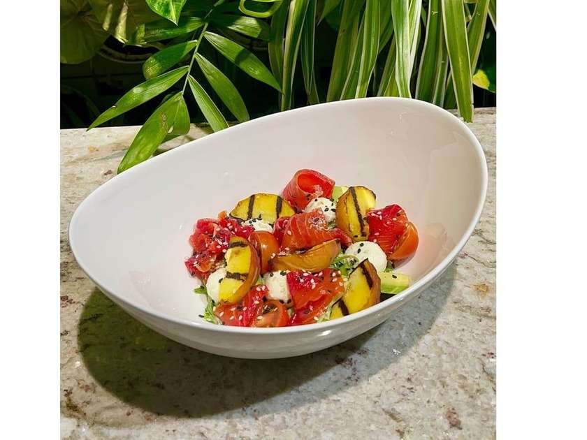 Salad with lightly salted salmon and labneh cheese