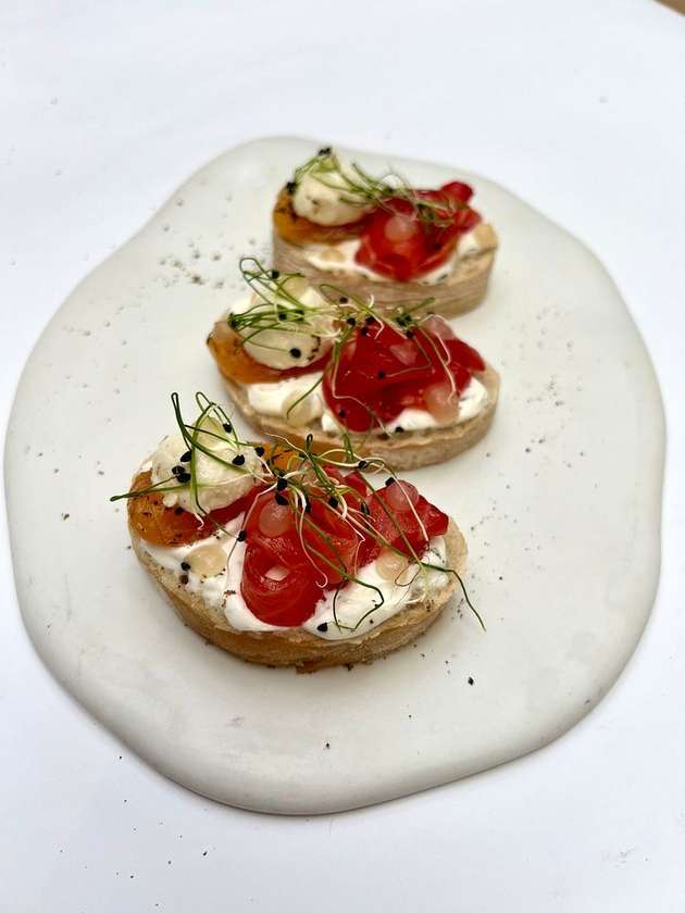 Bruschetta with lightly salted salmon, peach and labneh cheese