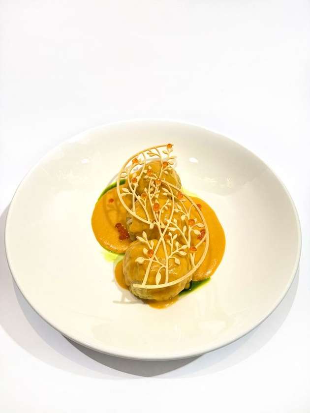 Dumplings with shrimp with bisque sauce