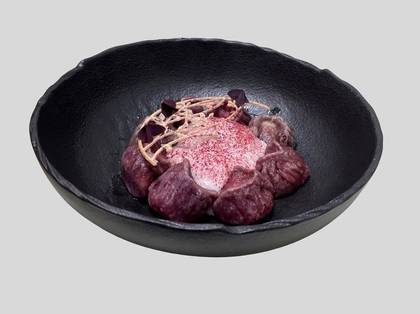 Dumplings in beetroot juice with rabbit
