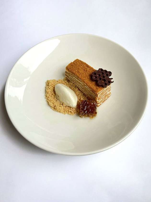 Buckwheat honey cake with honeycombs and vanilla ice cream.