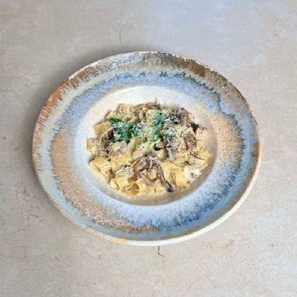 Pasta with mixed mushrooms in cream sauce