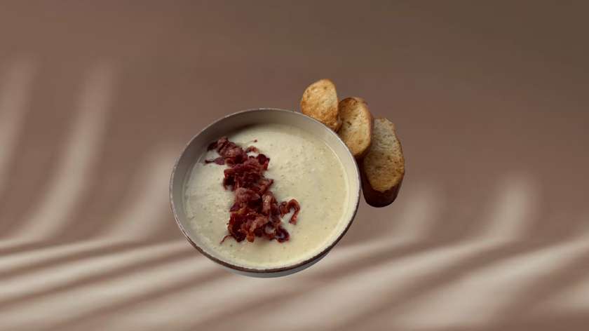 Potato cream soup with crispy bacon