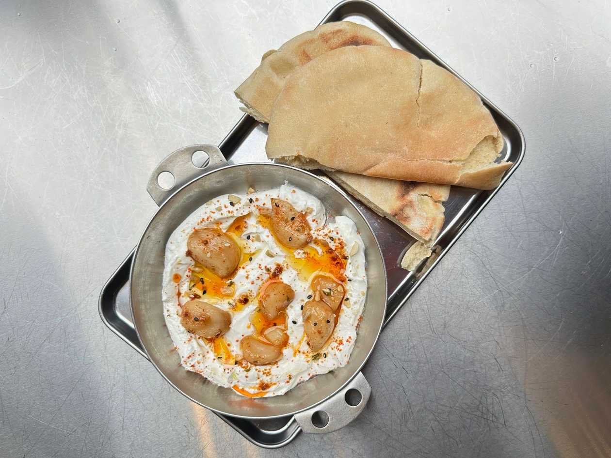 Labneh Dip w Garlic Confit, Harissa Sauce, and Pistachio