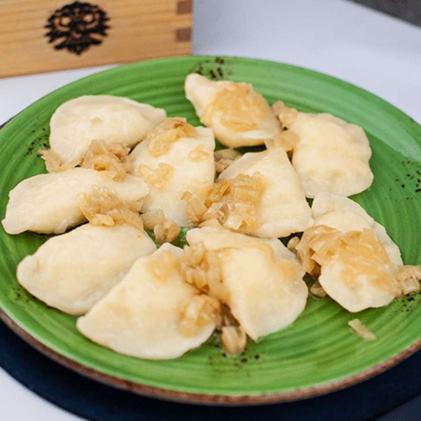 Cottage cheese and potatoes pierogi served with grilled onions 10 pcs