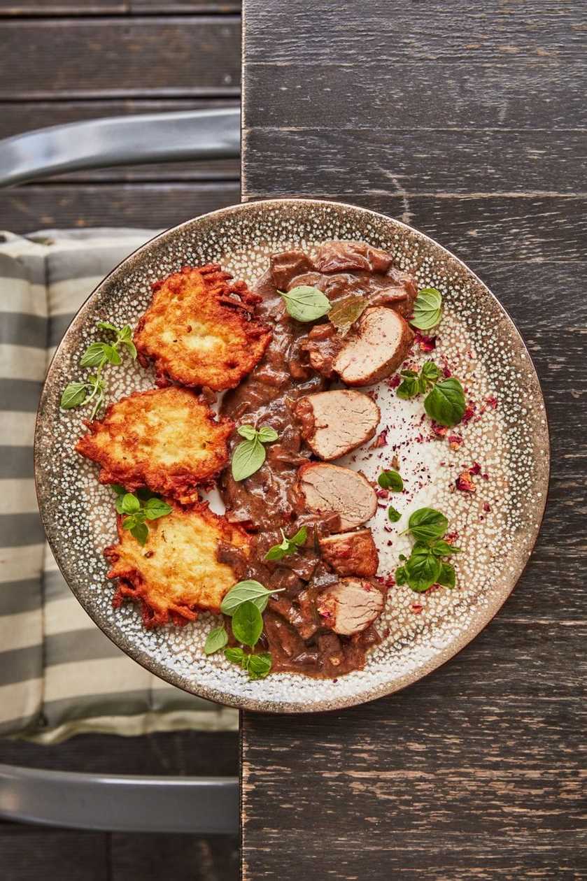 Pork tenderloin with potato pancakes and mushroom sauce