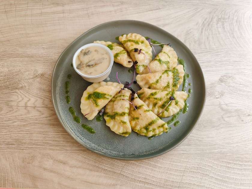 Varenyky with rabbit in mushroom  sauce
