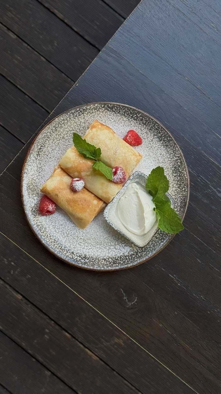 Crepes with cottage cheese and raisins