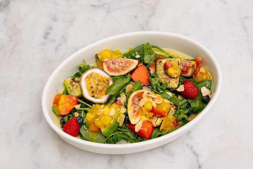 Vegetarian salad with roasted avocado and berries