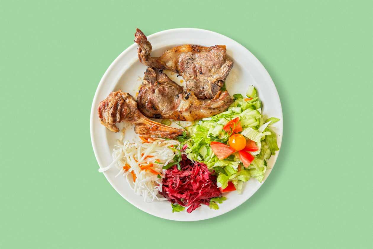 3 grilled lamb chops, side dish, salad and dressing