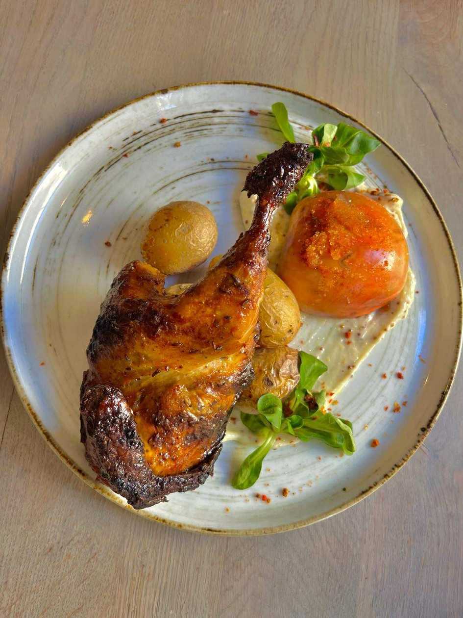 Half chicken with mashed potatoes and baked apple